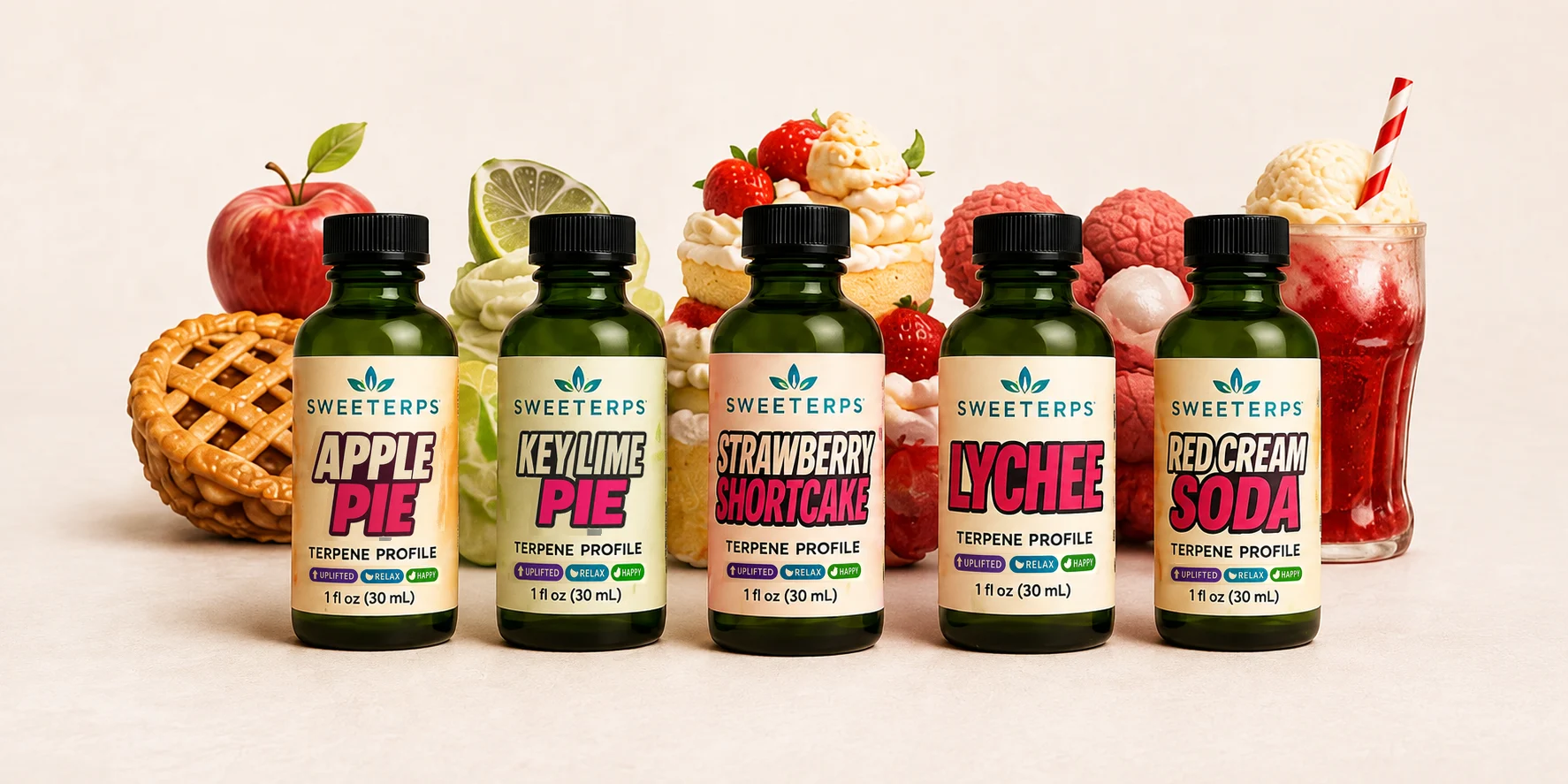Apple Pie, Key Lime Pie, Strawberry Shortcake, Lychee and Red Cream Soda terpene profile bottles with fruit and dessert props